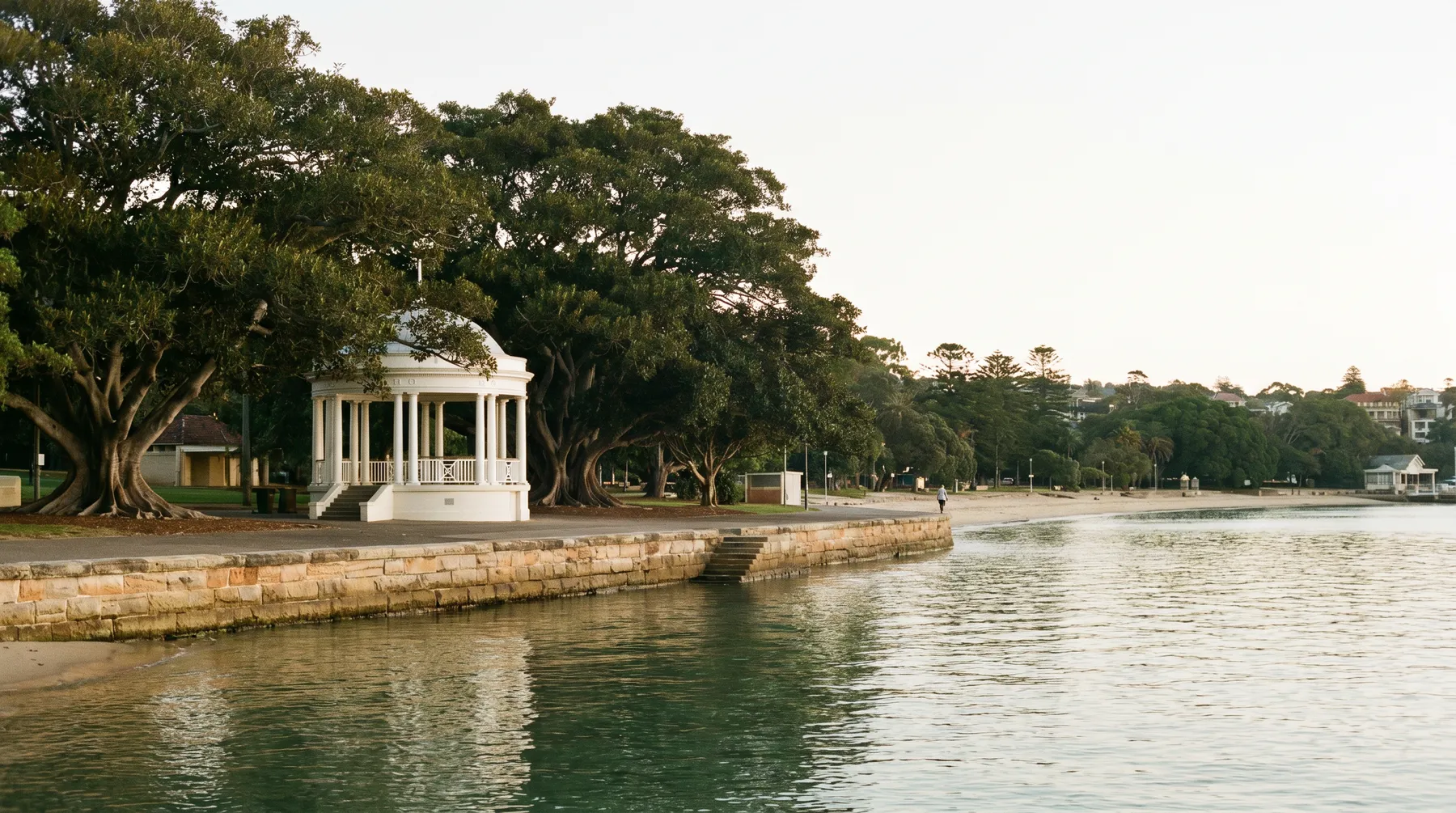 Balmoral rotunda and promenade at first light, fig trees and still water